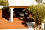 Luxury villas in Greece - Xenon Estate swimming pool deck with a kiosk under a pergola